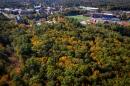 aerial photo of 主要研究 College Woods in fall with football stadium in background